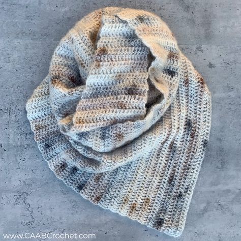 This easy asymmetrical crochet scarf pattern is as beginner friendly as it can get! The entire pattern is made up of only double crochet stitches! If you are still a little bit of a newbie at crochet, but you want to try your hand at an asymmetrical scarf design, this is the pattern for you! Free pattern from Cute As A Button Crochet & Craft! Crochet Asymmetrical Scarf Pattern Free, Moss Stitch Scarf Crochet, Diagonal Crochet Scarf, Asymmetrical Crochet Shawl Free Pattern, Asymmetrical Shawl Crochet Pattern, Asymmetrical Crochet, Crochet Scarf Pattern, Cute As A Button, Crochet Buttons