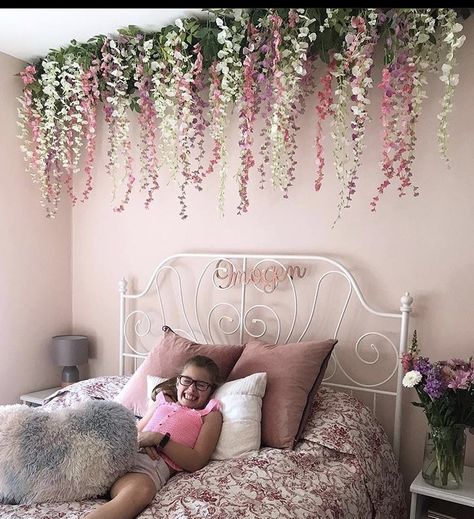 Bedroom Flower Ceiling, Bedroom Ceiling Flowers, Hanging Flower Bedroom, Flower Hanging From Ceiling Bedroom, Flower Vine Ceiling Bedroom, Wisteria Canopy Bedroom, Flowers On Headboard, Flower Garland Bedroom Ceiling, Girly Bedroom Wall Decor