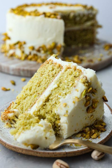 This light and airy Pistachio Cake is made from scratch, full of real pistachios, and topped with a delicious buttercream frosting. It's a classy cake that will impress your guests on any occasion! Luck Of The Irish Cake, Cake With Pistachio Cream, Pistachio Butter Cake, Homemade Pistachio Cake, Pistachio Cake From Scratch, Best Pistachio Cake Recipe, Pistachio Cake Pops, Pistachio Almond Cake, Recipes With Pistachio Butter