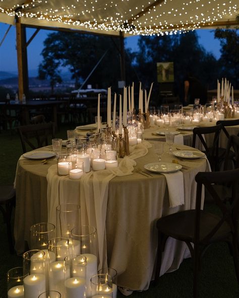 a stunning + intimate candlelit reception space and the cutest couple! —— Design: @hannahsessionsphotography Coordinator: @sierrajamesevents Creative Direct: @mollyyyyhoward Venue: @terrathevenue Florals: @christinepetalplanners Linens: @bbjlatavola Candles: @socalcandlerentals Chairs: @adorefolklore Tablescape: @bondirentals Spray tan: @tannedbymolly Hair: @bridesbygenevieve Makeup: @lindseymarie_mua Vendor content: @behindthesparks Dresses: @archive_bridal Suits: @fiartux Models: @alicia... Serpentine Tables, Circle Tables, Candle Runner, Candle Lit Table, Round Table Runner, Candlelit Reception, Candlelit Table, Candle Lit Wedding, Wedding Runner