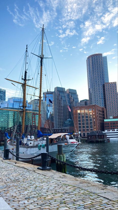 Skyline view of Boston in the Seaport with a beautiful boat docked in Boston Harbor Boston Massachusetts Apartments, Everything Is Better In Boston, Better In Boston, Boston Pictures, Boston Aesthetic, East Coast Summer, Boston Trip, Boston Apartment, Boston Restaurants