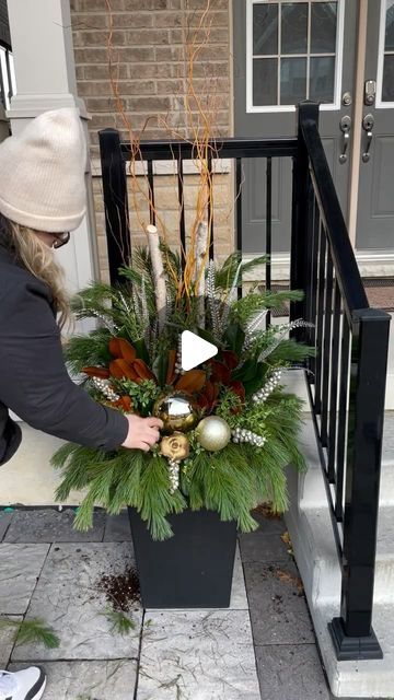 Vanessa Monardo on Instagram: "When creating a planter to add interest all winter, I like to focus on TEXTURE!   Incorporate greens like boxwood, Sapphire and Oregonia with your cedars and pines to really add character and lasting drama.   This neutral winter planter is perfect for taking your home through the winter months!" Outdoor Christmas Baskets, Front Door Christmas Planter Ideas, Christmas Front Door Planters, Christmas Door Planters, Christmas Porch Topiaries, Decorating Planters For Christmas, Front Door Planters Winter, Christmas Pot Decorations Outdoor, Outdoor Christmas Greenery Pots