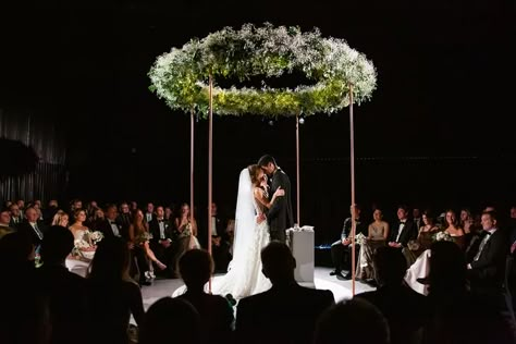 Modern Dark Ceremony with Round Greenery Chuppah Chuppah With Greenery, Jewish Wedding Chuppah, Fire Wedding, Wedding Chuppah, Jewish Wedding Ceremony, Philly Wedding, Neutral Wedding Colors, Wedding Roles, Wedding Planning Book