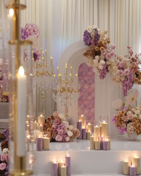 A distinct and unforgettable look: our reception stage with unique purple and warm nude latte florals. Styling, decor, flowers and set up by @museweddingsandevents Candles by @rosewood.candles Photography by @picturethis.photographysydney Venue @novellaonthepark Stage wrap by @ido_dancefloors Chandeliers by @chandelierstodiefor Draping by @sydney_backdrops Mauve Wedding Decor, Purple Wedding Reception, Nikah Decor, 50th Birthday Decorations, Mauve Wedding, 40th Wedding Anniversary, Purple Decor, Chocolate Decorations, Wedding Theme Colors