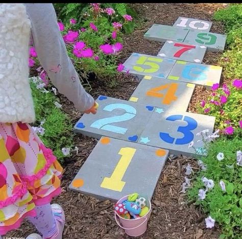 20 Stunning Garden Path Ideas to Transform Your Outdoor Space Diy Hopscotch Outdoor, Playground Accessories Diy, Outdoor Play Area Flooring Ideas, How To Paint Pavers, Backyard Sidewalk Ideas, Paver Hopscotch, Backyard Hopscotch, Hopscotch Pavers, Painted Pavers Ideas