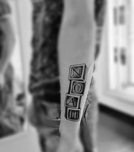 awesome kids name noah blocks mens outer forearm tattoo Kids Name Tattoo Ideas For Men, Noah Tattoo, Name Tattoos For Men, Outer Forearm Tattoo, Kid Name Tattoo, Awesome Tattoo Ideas, Names Tattoos For Men, Tattoo Design Hand, Back Shoulder Tattoos