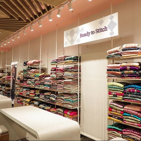 Fabric Rack Display, Saree Shop Interior Design, Cloth Showroom, Textile Showroom, Saree Showroom, Clothes Rack Design, Fabric Shop Display, Clothing Showroom, Clothing Boutique Ideas