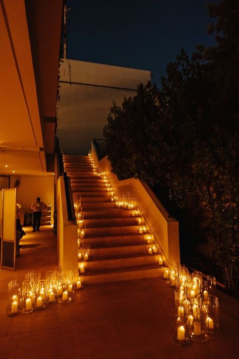 Stairs decorated with a lots of candles Staircase With Candles, Candles Stairs Wedding, Candles On Stairs Wedding, Stairs Wedding Decoration, Wedding Stairs Decor, Candles Stairs, Candles On Stairs, Staircase Candles, Palace Wedding Decor