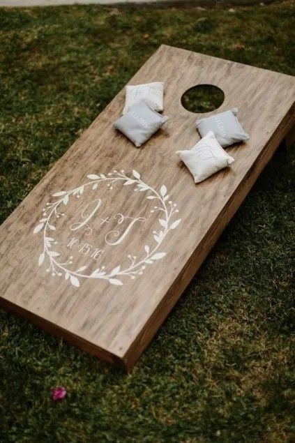 Wedding Games Cornhole, Farm Wedding Games, Cornhole At Wedding Reception, Corn Hole At Wedding, Corn Hole Wedding Game, Garden Games For Wedding, Wedding Ideas Games Activities, Backyard Reception Games, Board Game Table At Wedding