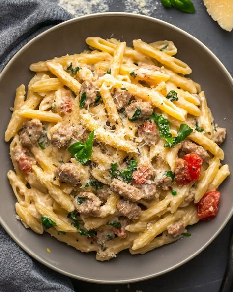 This Creamy Italian Sausage Pasta combines the richness of heavy cream with the savory depth of Italian sausage. Roasted red peppers and fresh spinach add vibrant flavors and a pop ... Read more Creamy Spicy Italian Sausage Pasta, Pasta And Red Sauce Recipes, Italian Sausage Tacos, Things To Make With Italian Sausage, Southern Italian Recipes Authentic, Mild Italian Sausage Recipes Dinners, Sweet Italian Sausage Recipes Dinners, Pasta And Sausage Recipes, Spicy Italian Sausage Recipes