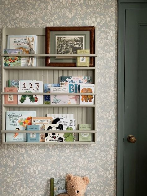 Prettyinthepines Nursery, Books Nursery Storage, Cork Board Nursery Ideas, Built In Bookshelf Nursery, Nursery When You Dont Know The Gender, Nursery Peg Shelf, Book Shelf Nursery Ideas, Book Storage For Nursery, Children Book Shelf