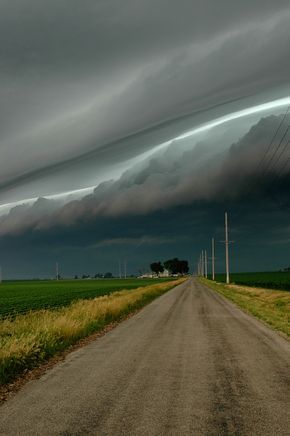 Stormy morning. The stadium effect. The eyewall of the hurricane curved ’round them like a bowl, like a stadium.  Photography by Rachel Gardner Weather Cloud, Storm Chasing, Stormy Skies, Cloud Formations, Wild Weather, Forces Of Nature, Stormy Weather, Dirt Road, Storm Clouds