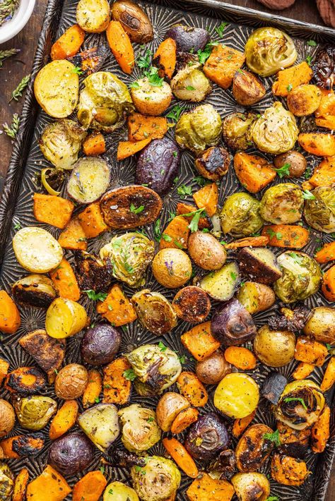 Brussels sprouts, carrots, and potatoes are tossed with olive oil and fresh herbs then roasted to perfection in this Oven Roasted Vegetables recipe. Quick, easy, and you can easily adapt the recipe to include your favorite veggies and herbs. Over Roasted Vegetables, Roasting Vegetables In Oven Recipes, Roasted Vegetables With Brussel Sprouts, Veggie Medley Recipes Roasted Vegetables, Toasted Vegetables In Oven, Broiled Vegetables In Oven, How To Roast Vegetables In The Oven, Roasted Brussel Sprouts And Potatoes, Roasting Vegetables In Oven