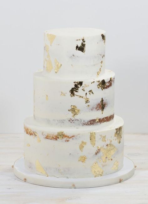 Modern White & Gold Wedding Cake | Good leaf on white buttercream cake Gold Foil Wedding Cake, Wedding Cake Gold Leaf, White And Gold Wedding Cake, Semi Naked Cake, Wedding Cake Prices, Romantic Summer Wedding, White And Gold Wedding, Small Wedding Cakes, Naked Cakes