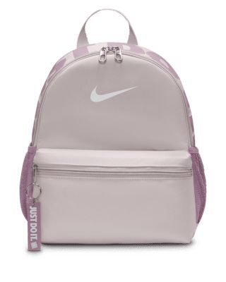 A small but mighty bag, the Nike Brasilia JDI Backpack is just the bag for wherever your day takes you. Perfect for hanging out with friends or adventuring around town, this bag features a spacious double-zippered main compartment for the essentials and a smaller front pocket for the small stuff that you need to grab quickly. Shown: Platinum Violet/Plum Dust/White Style: DR6091-019 Nike Brasilia Backpack, Nike Mini Backpack, Backpack Nike, Nike Bag, Nike Backpack, Stylish School Bags, Small But Mighty, Small Stuff, Hanging Out With Friends