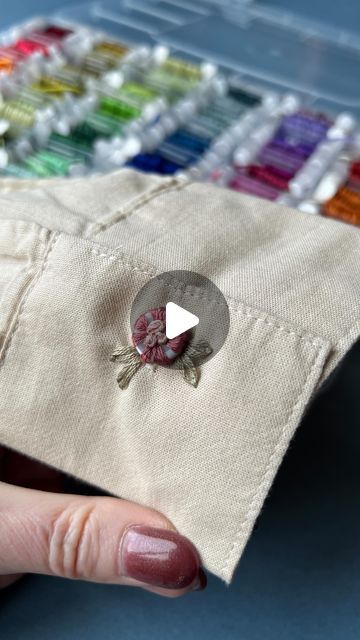 Jenny ~ Embroidery Art, Design & Crafts on Instagram: "Here’s another little button idea. 🌸 Do you like it? I have used the lazy Daisy stitch and French knots to secure the button, and it’s fully usable if you need to undo it.
.
.
#upcycledclothing 
#upcycledfashion 
#embroideredflowers 
#embroideredclothing 
#embroidereddenim 
#embroideredclothes 
#embroideredflorals 
#learntoembroider 
#mindfulart 
#slowstitching 
#sewingproject 
#embroiderypatterns 
#bordadolivre 
#createdtocreate 
#diycrafts 
#slowcraft 
#dmcthreads 
#dmcembroidery 
#springflowers 
#embroiderydesign 
#beginnerembroidery 
#embroiderywork 
#denimembroidery 
#sustainablefashion 
#embroiderhappyhoops 
#embroiderytutorial 
#embroideryprocess 
#embroideryproject 
#handsew" Button Embroidery Ideas, Button Designs Ideas, Button Embroidery, French Knot Stitch, Daisy Stitch, Trendy Sewing Projects, Learning To Embroider, Lazy Daisy Stitch, Diy Embroidery Designs