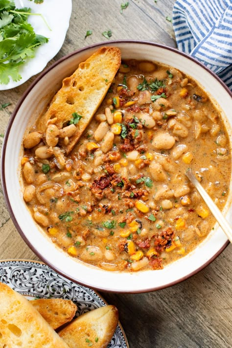 This Creamy White Beans & Soy Chorizo recipe is a cozy one-pot dinner. The beans are simmered in a creamy broth & topped with soyrizo & corn! Chorizo Bean Soup, Soy Chorizo Recipes, Kosher Rules, Vegan Proteins, Creamy White Beans, Legume Recipes, Chorizo Recipe, Soy Chorizo, Vegan Stuffed Peppers