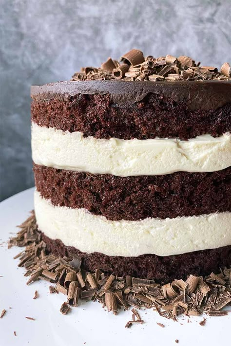 Love the classic pairing of chocolate and vanilla? Our chocolate cake with Bavarian cream has all the familiar tastes combined with a fun presentation. Entertain the palate and the eyes with alternating layers of rich cake, airy whipped cream, and a ganache topping. Get the recipe. #chocolatecake #bavariancream #foodal Bavarian Cream Cake Recipe, Bavarian Cream Cake, Bavarian Cream Filling, Chocolate Filling For Cake, Chocolate Cream Cake, White Cake Recipes, Vanilla Cream Filling, Chocolate And Vanilla Cake, Chandelier Cake