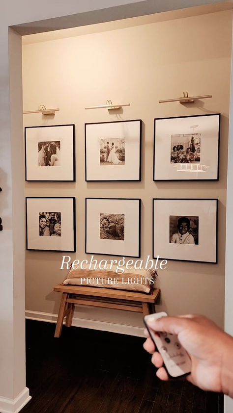 Over Picture Light, Wall Gallery With Lights, Picture Frame With Light Above, Frame Wall With Lights, Lighting Over Picture Wall, Light Over Photo Wall, Scone Light Over Pictures, Gallery Lights Wall, Hallway Gallery Wall With Lights