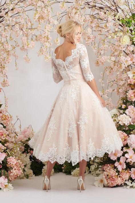 Elegant blush ballerina length wedding dress with three quarter sleeves Tea Length Embroidered Wedding Dress, Wedding Dress For 35 Year Old, Pinup Style Wedding Dress, Modern Tea Length Wedding Dress, Vintage Blush Wedding Dress, Vintage Wedding Dresses Plus Size, Tea Length Bridal Dresses, Wedding Dresses Midi Length, Cream Wedding Dress With Sleeves