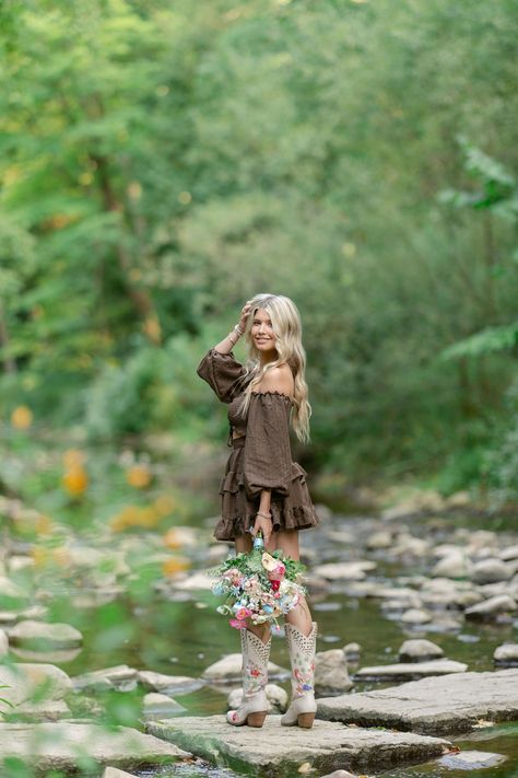 Wisconsin-based photographer photographs a western-themed seniors session with the senior taking photos on a creek in Appleton, while she's dressed in a cute flowy brown dress, with her cowgirl boots, and many other location ideas and inspiration for senior portraits.  #Westernseniorportraits #Appletonphotographer #Wisconsinseniors Western Style Senior Photos, Fall Photoshoot Western, Fall Senior Picture Ideas Outfits Country, Senior Photos In Creek, Senior Picture Inspiration Fall, Cute Fall Senior Pictures, Cute Country Senior Picture Ideas, Western Senior Picture Poses, Fall Themed Senior Photos