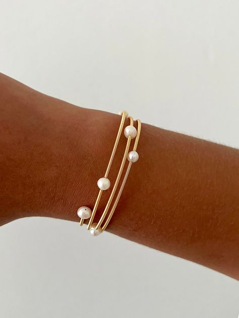 A wrap-around gold plate pearl bracelet Fantasy Earrings, Preppy Jewelry, Reflecting Light, Snake Jewelry, Jewelry Accessories Ideas, Prom Jewelry, Jewelry Essentials, Classy Jewelry, Stacked Jewelry