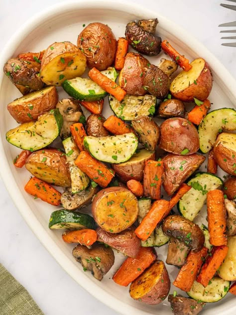 Delicious and seasoned to perfection, roasted veggies add color and texture to any meal! A dash of olive oil and Roasted Veggies Dinner, Adding Vegetables To Meals, Veggie Medley Recipes Roasted Vegetables, How To Cook Mixed Vegetables, Roasted Veggie Side Dishes, Mix Veggies Recipes, How To Add Veggies To Every Meal, Veggie Mix Recipes, Bakes Veggies