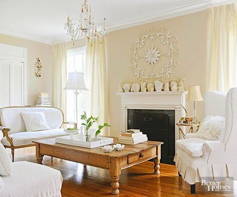 Pale Yellow Living Room, Distressed Wood Floors, Distressed Wood Table, Warm Wood Flooring, Rustic Wood Floors, Living Room Wall Color, French Country Living Room, Yellow Living Room, Mccoy Pottery