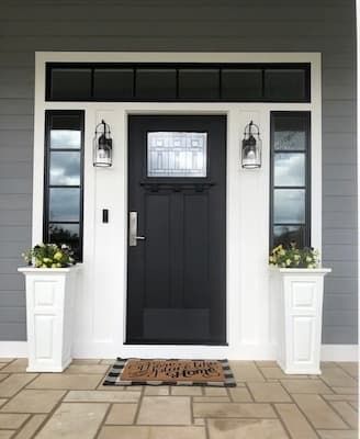 A replacement front entry door with framed sidelights and a transom window provides a striking upgrade to this Manhattan, Kansas, home. Front Door Trims, Front Door Knob, Front Door Sidelights, Pella Doors, Craftsman Front Door, Black Entry Doors, Entry Door Colors, Door Sidelights, Entry Door With Sidelights