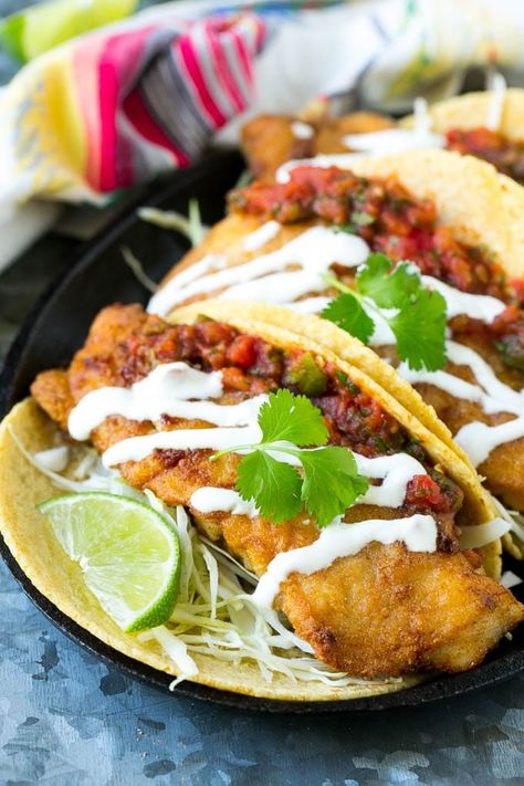 This recipe for Baja fish tacos is crispy fish fillets with cabbage, salsa and creamy sauce, all wrapped in warm corn tortillas. Fish Tacos Crispy, Cabbage Salsa, Easy Fish Taco Recipe, Tacos Dinner, Tacos Fish, Fried Fish Tacos, Fish Taco Recipe, Easy Fish Tacos, Baja Fish Tacos