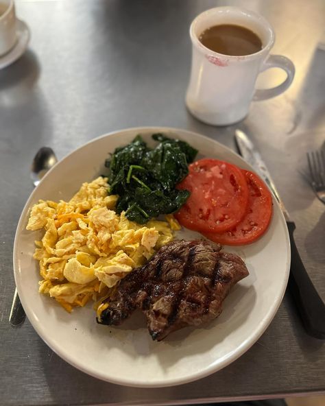 The breakfast of champions. Steak and eggs with a 6oz ribeye, scrambled eggs with 🥚 🧀 , fresh tomatoes 🍅, sautéed spinach 🥬 and a side of coffee ☕️ And the best seat of the house as a solo traveler - right at the kitchen pass. #foodie #foodporn #foodblogger #foodphotography #foodislife #memorablefood #chicagogirlinasouthernworld #foodiesofinstagram #wilmington #thebasicsilm #breakfast #steakandeggs Healthy Steak And Eggs Breakfast, Egg And Steak Breakfast, Steak And Scrambled Eggs, Food For When Your Sick, Steak Breakfast Ideas, American Breakfast Ideas, Steak And Eggs Breakfast, Meat And Vegetable Diet, Eggs And Spinach