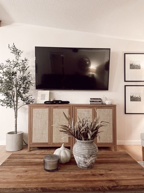 Tv On Wall Decor Ideas, Under Television Decor, 65” Tv On Wall, Minimal Tv Stand Decor, Tv Stand Organic Modern, Modern Tv Console Decor, Living Room Wall Decor Sides Of Tv, Modern Organic Living Room Tv, Media Console Decor Mounted Tv