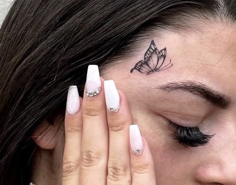 Butterfly Face Tattoos For Women, Small Face Tattoos For Women Under Eye, Tattoo Over Eyebrow, Butterfly Tattoo Face, Sparkle Face Tattoo, Baddie Face Tattoos, Eyebrow Tattoos For Women, Tiny Face Tattoos For Women, Dainty Face Tattoos