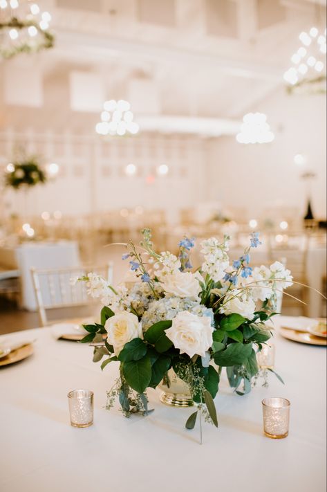 Light Blue Greenery Wedding, White And Light Blue Floral Centerpieces, Low Blue Centerpieces, Light Blue And Greenery Wedding, Blue And White Wedding Table Flowers, White And Light Blue Flower Arrangements, Blue And White Flower Arrangements Centerpieces, White Green And Blue Wedding Centerpieces, Blue And Green Wedding Centerpieces