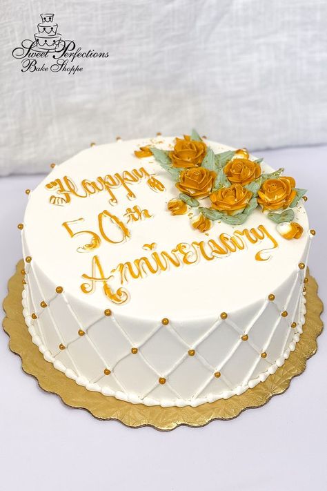 Celebrate a half century of love with cake especially designed for a golden anniversary. You choose your size and flavors, and we’ll ice it in our signature vanilla buttercream, add buttercream quilting and gold pearls on the side, then pipe a spray of gold roses with a touch of edible glitter next to your inscription. This simple design idea is available to order for your party right off our website! Minimum seven days’ notice; local pickup only. #spbakeshoppe Wedding Anniversary Cake Design Simple, Simple Anniversary Cakes, Anniversary Cake Pictures, Golden Anniversary Cake, Anniversary Cake Designs, 50th Anniversary Cakes, Blue Sky Wallpaper, Custom Desserts, Gold Roses