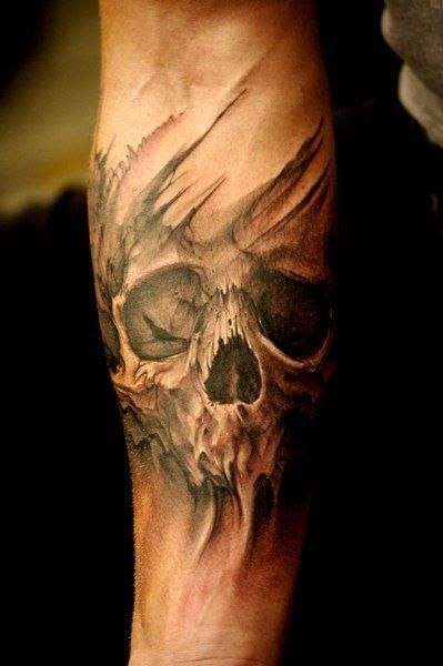 This forearm tattoo highlights a ghastly yet strikingly beautiful face of a skull. It seems to have a life of its own with long black veins above and below the intricate drawing this delicately inked picture is made up of. #tattoofriday #tattoos #tattooart #tattoodesign #tattooidea Skull Sleeve Tattoos, Skull Sleeve, Biker Tattoos, Sugar Skull Tattoos, Geniale Tattoos, Skull Tattoo Design, Celtic Tattoos, Badass Tattoos, Sleeve Ideas