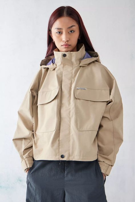 All-weather water-resistant jacket by iets frans... complete with a utility design and soft nylon shell. Zip-up, boxy silhouette jacket Ft. a funnel neck, a velcro concealed placket with popper fastenings, drop shoulders, long sleeves, stretchy cuffs and two patch pockets at the front. Topped with a fixed hood. Only at Urban Outfitters. Waterproof Jacket Outfit, Holographic Print, Utility Design, Utility Vest, Water Resistant Jacket, Hooded Parka, Waterproof Jacket, Soft Shell Jacket, Lumberjack