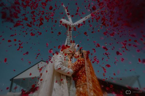 Brinda and Yashraj seal their love with a passionate kiss under a shower of rose petals after the Varmala ceremony. Brinda and Yashraj Makeup by Foram Atara For More Visit Our Website www.cupiddiaries.com #EverlastingLove #HappilyEverAfter #RosePetalsRomance #MagicalMoments #VarmalaCelebration #LoveWins #KissOfLove #WeddingBliss #SweetEmbrace #Newlyweds #CupidDiaries #destinationweddingphotographer #fearless1125 Varmala Ceremony, Sangeet Decor, Wedding Entrance, Everlasting Love, Rose Petals, Destination Wedding Photographer, Pre Wedding, Happily Ever After, Lobby