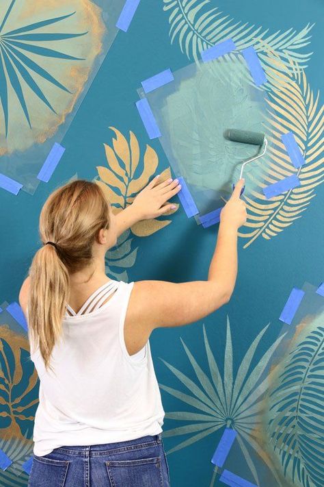 Bring the tropics into your space with these fun leaf stencils by Home Talk. Stencilling is cheaper (and more creative) than pricey wallpapers - so it's the perfect project if you're looking to update your home on a budget. | Painted Wall DIY | Home Decor Inspiration | Interior Design | Wonder Forest Rainbow Painted Walls, Tropical Wall Mural, Wall Stencils Diy, Tropical Trend, Wall Murals Diy, Mural Stencil, Popular Interior Design, Stencil Projects, Leaf Stencil