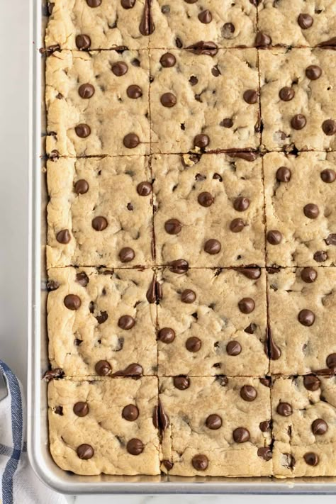 Sheet Pan Chocolate Chip Cookie Bars by The BakerMama Sheet Cake Cookie Bars, Sheet Pan Bars Cookie Recipes, Sheet Pan Blondies, Chocolate Chip Cookie Bars Sheet Pan, Chocolate Chip Pan Chewies 12 Tomatoes, Chocolate Chip Sheet Pan Cookies, Sheet Pan Chocolate Chip Cookies, Sheet Cake Desserts For A Crowd, Sheet Pan Chocolate Chip Cookie Bars