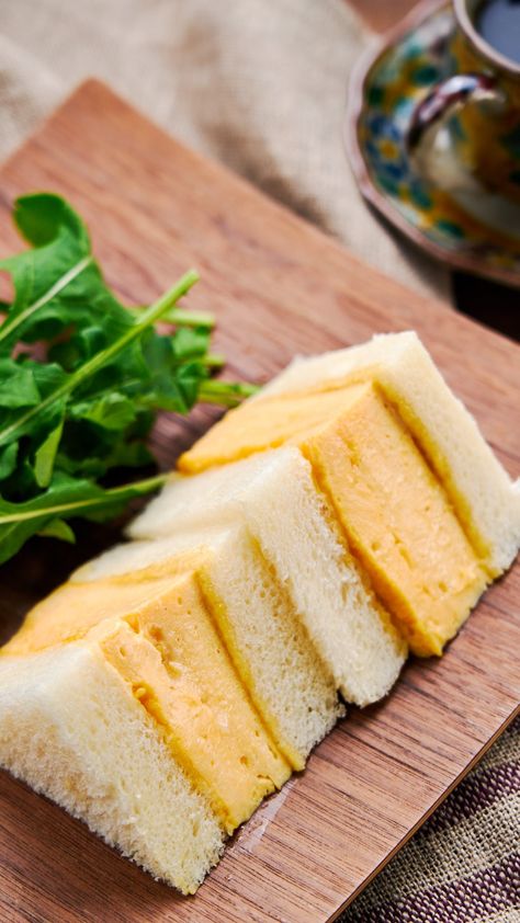 This Kyoto style Dashimaki Tamago Sando stuffs a tender, fluffy Japanese omelette between two thick slices of shokupan (Japanese sandwich bread) to make for a delightfully flavorful and satisfying egg sandwich. Japanese Egg Omelette, Japanese Egg Sandwich Recipe, Dashimaki Tamago, Handheld Recipes, Japanese Sandwiches, Japanese Egg Sandwich, Asian Potluck, Tamago Sando, Omelette Sandwich