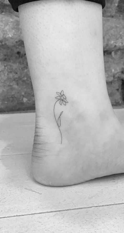 Fine Daffodil Tattoo, Narcissus Flower Tattoo Small Simple, Welsh Inspired Tattoos, 3 Daffodil Tattoo, Ankle Daffodil Tattoo, Daffodil With Bee Tattoo, Daphadil Flower Tattoo Simple, Simplistic Daffodil Tattoo, Lavender And Daffodil Tattoo