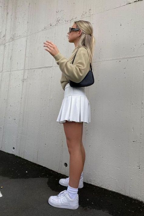 6 Cute White Tennis Skirt Outfit Ideas White Tennis Skirt Outfit Ideas, White Tennis Skirt Outfit Street Style, White Tennis Skirt Outfit Summer, Tennis Skirt And Sweatshirt, Style A Tennis Skirt, How To Style A Tennis Skirt, Tennis Skirt Outfit Ideas, Tennis Skirt Outfit Summer, Tennis Skirt Outfit Street Style