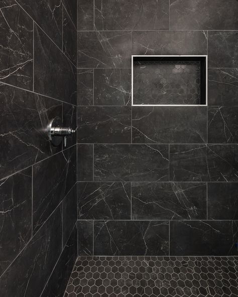 Bold, beautiful, and timeless: these black-tiled showers truly make a statement! Whether you choose a glossy or matte finish, black tiles create a stunning backdrop that complements any design.  Builder: @restorebuildanddesign  Design: @hawkinsandgraydesign  Photos: @lyndseymariephotography Black Marble Shower Tile, Best Shower Tile Ideas, Black Showers Bathroom, Dark Bathroom Accent Wall, Matte Black Shower Tile, Black Tile Shower Wall, Black Marble Shower Walls, Black Walk In Shower Ideas, Dark Grey Shower Tile