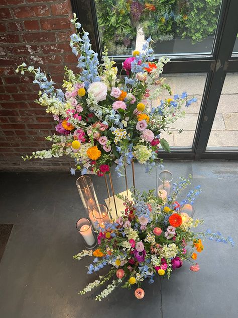 Interesting Floral Arrangements, Colorful Floral Wedding Centerpieces, Tall Wildflower Arrangements, Wildflower Table Decor Wedding, Multicolor Flower Wedding, Wildflower Themed Wedding Centerpieces, Colorful Floral Arrangement Centerpiece, Colourful Floral Centrepiece, Wedding Altar Vases