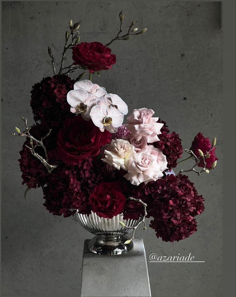 Dark Academia Floral Arrangements, Dark And Moody Flowers, Dark And Moody Wedding Florals, Red Hydrangea Centerpiece, Red And Purple Table Decorations, Dark Pink Flower Arrangements, Dark Moody Flowers, Wedding Florals Burgundy, Dark Romantic Wedding Flowers