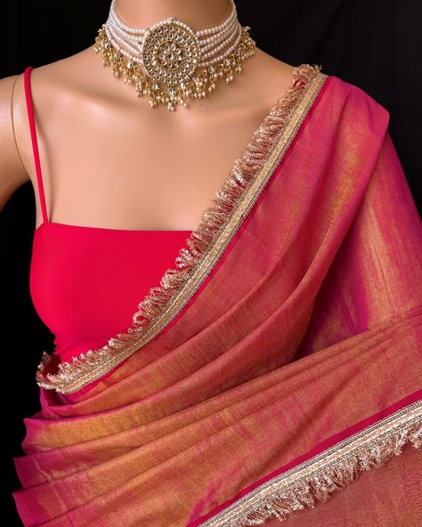 Pink gold tissue saree with contrast golden lace all over sarees. Comes with beautiful red thread tassels on pallu. Blouse: running blouse 80cm. To find this product in website: Www.thejacouture.in > Tissue sarees> pink Gold tissue saree. Jewellery collaboration: @anvi__jewellery #mettalictissuesaree #tissuesaree #trendingsaree #tissuelacesaree #traditional #pinktissuesaree Gold Saree With Contrast Blouse, Golden Saree With Contrast Blouse, Pink Saree Contrast Blouse, Pink Tissue Saree, Gold Tissue Saree, Net Saree Designs, Thread Tassels, Tissue Sarees, Golden Saree