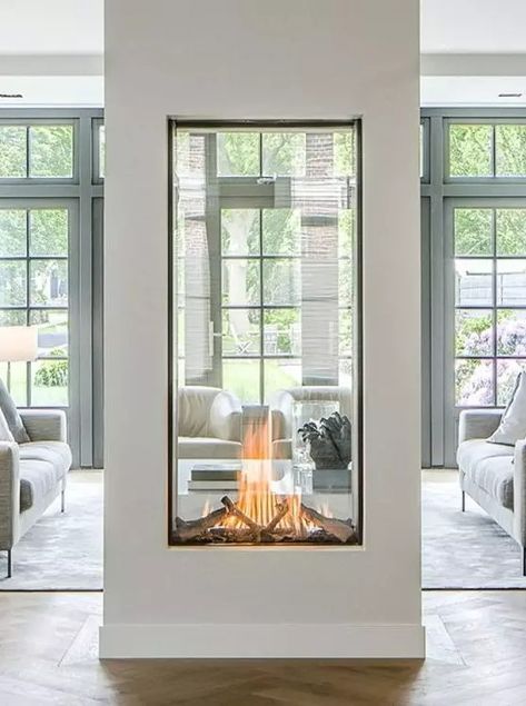 a two sided fireplace with glass will provide two spaces with a beautiful fire look and with coziness and chic Modern Glass Fireplace Ideas, Glass Fireplace Ideas, Two Sided Fireplace Ideas, Double Sided Fireplace Ideas, Bell Fireplace, Fireplace Under Window, Enclosed Fireplace, Fireplace Room Divider, Dual Sided Fireplace