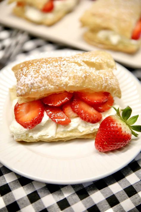 Easy Strawberry Napoleons are a delicious dessert that everyone will love. Flaky puff pastry layered with the easiest pastry cream and fresh strawberries. Puffed Pastry Strawberry Dessert, Puff Pastry And Strawberry Recipe, Strawberry Cream Pastry, Strawberries And Cream Puff Pastry, Puff Pastry Recipes Dessert Strawberries, Strawberry Desserts Puff Pastry, Puff Pastry Strawberry Shortcake, Strawberry Napoleon Puff Pastries, Strawberry Puff Pastry Dessert