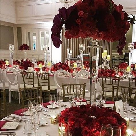 Striking red and white tablescape beauty with @lourdesmilian. Love the red orchid and rose blend. #LourdesMilian #red #redwedding #redweddingdecor #weddingdecor #weddingflowers #weddingtables #centerpieces #floral #flowers #redroses #roses #orchids #getti Flower Centrepiece Wedding, Flower Centrepiece, Rose Blend, Centrepiece Wedding, White Tablescape, Wedding Flower Decor, Red Orchid, Red Wedding Decorations, Baby Shower Garland